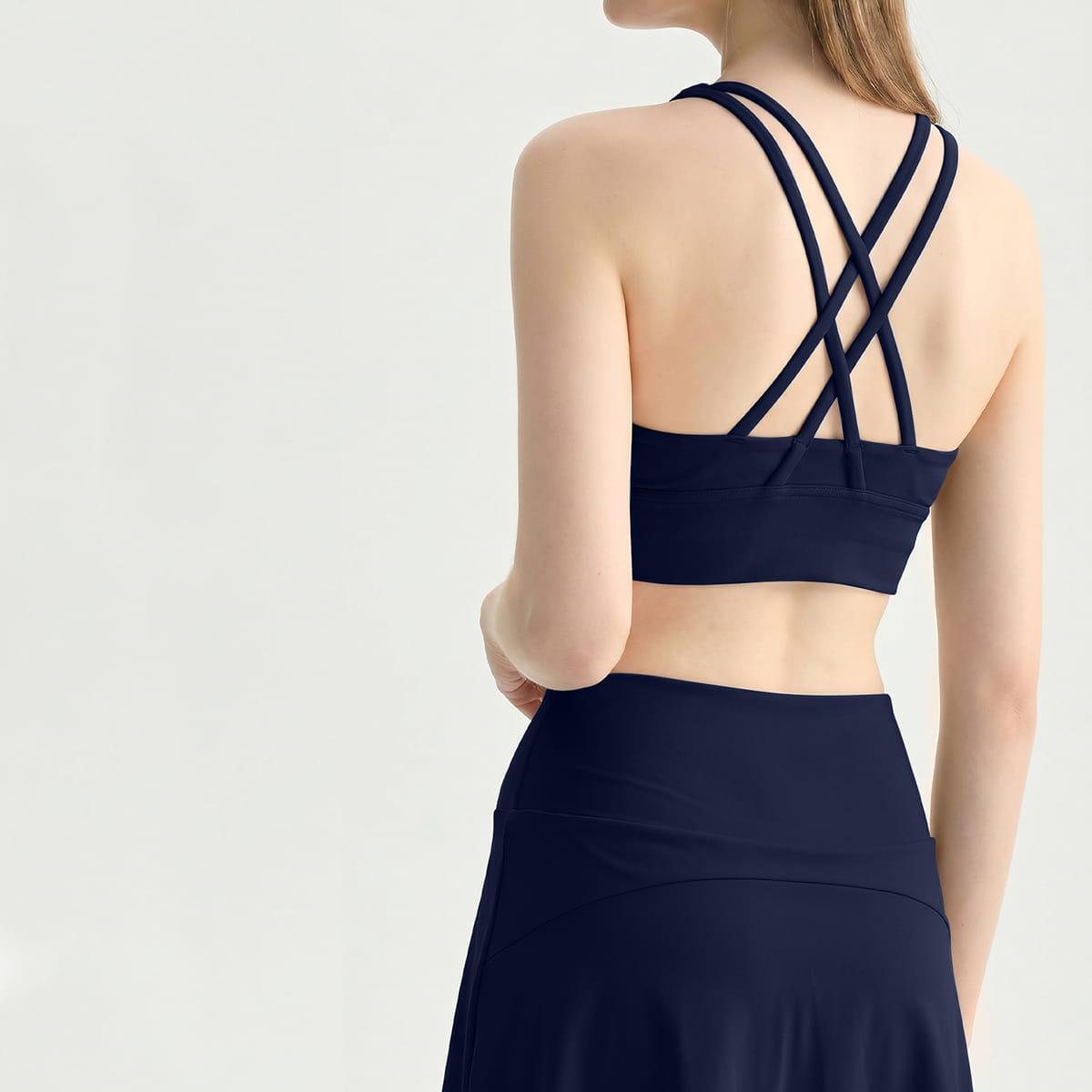 Back view of a midnight navy blue double cross-strap sports bra.