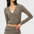 Women's deep V-neck full zip crop jacket in taupe with custom logo, custom yoga apparel manufacturer.