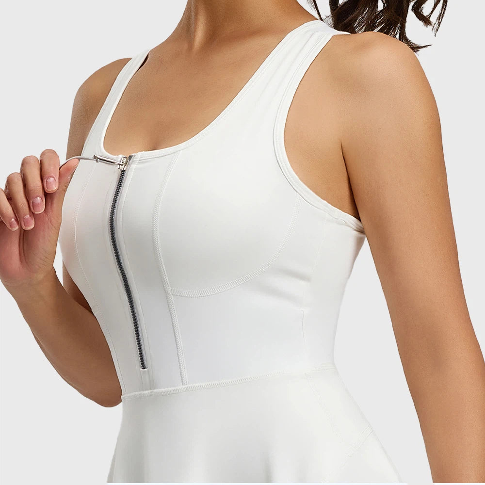 Close-up view of front zipper and contour corset seams on women's white athletic dress with custom logo, sportswear manufacturer.