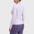 Back view showing ventilation flap on women's full zip athletic jacket in lilac with custom logo, OEM fitness apparel manufacturer.