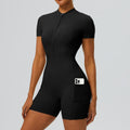 Front view of a black short-sleeve workout onesie with side phone pocket.