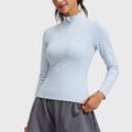 Women's breathable long sleeve half zip athletic running top in ice blue with custom logo, private label manufacturer - front view.
