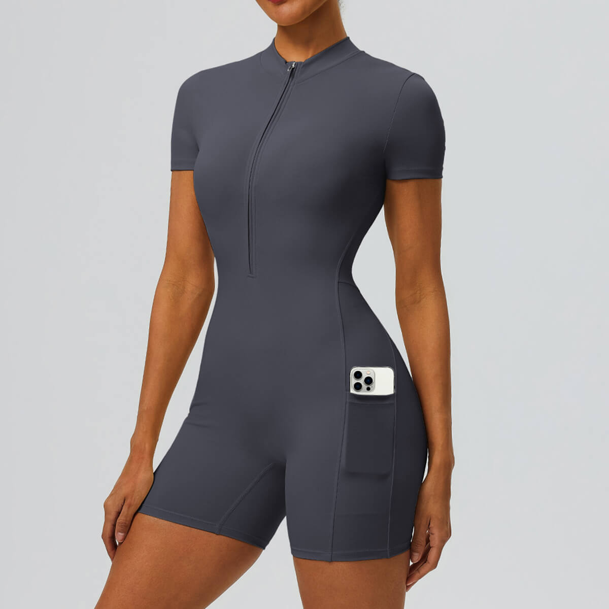 Front view of a charcoal grey fitted short-sleeve biker onesie with pocket.