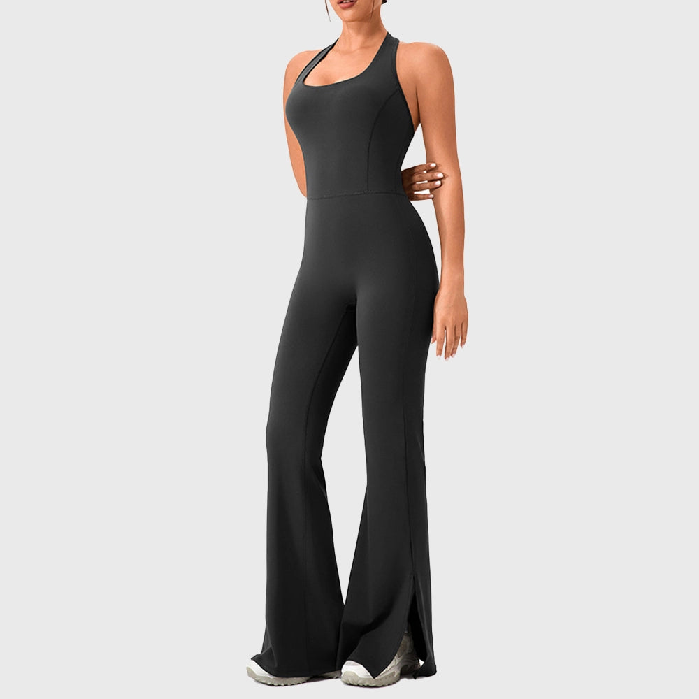 Women's halter backless split flare yoga jumpsuit in black with custom logo, OEM fitness apparel manufacturer - front view.
