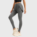 Side 3/4 view of women's high waist 2-in-1 running leggings with shorts in slate grey with custom logo, OEM activewear manufacturer.