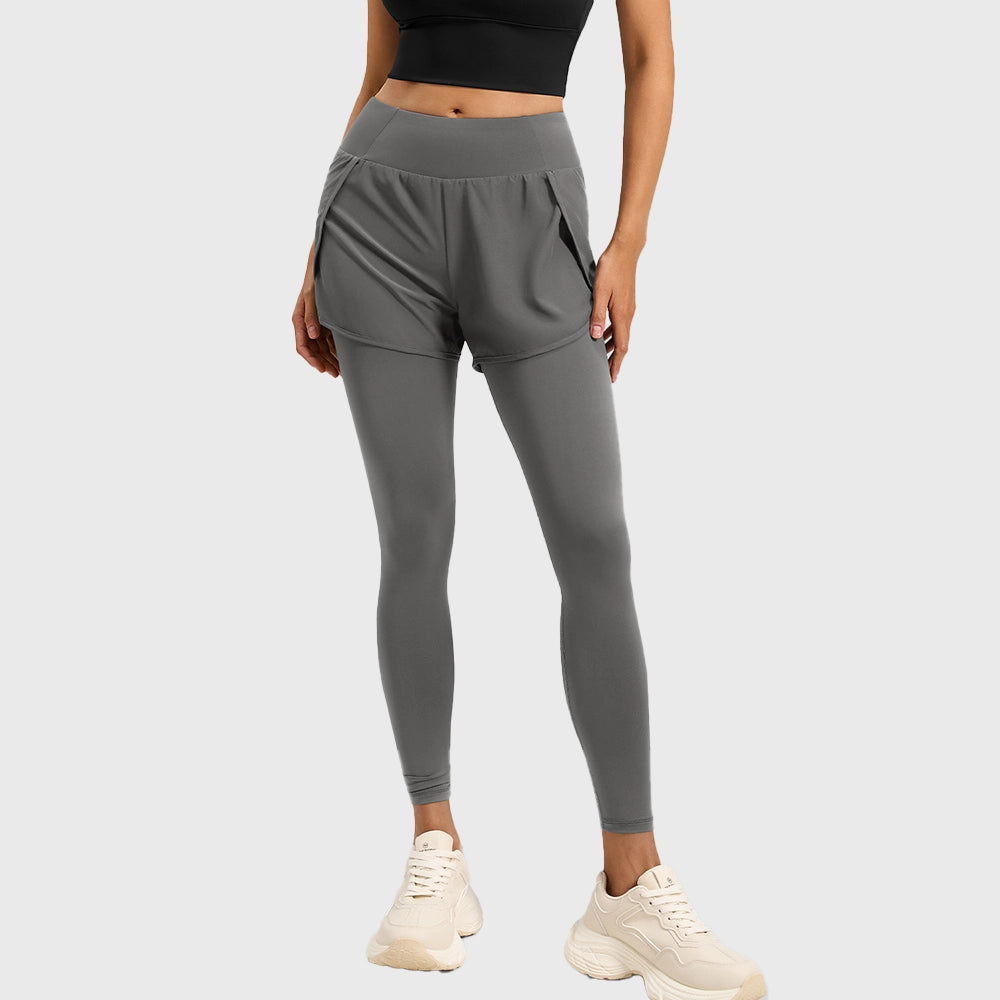 Women's high waist 2-in-1 running leggings with attached shorts in slate grey with custom logo, custom yoga apparel manufacturer - front view.
