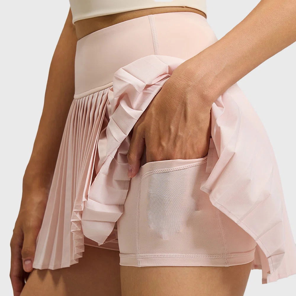 Detail of built-in shorts with phone pocket on women's pleated tennis skirt with custom logo, direct skirt manufacturer.