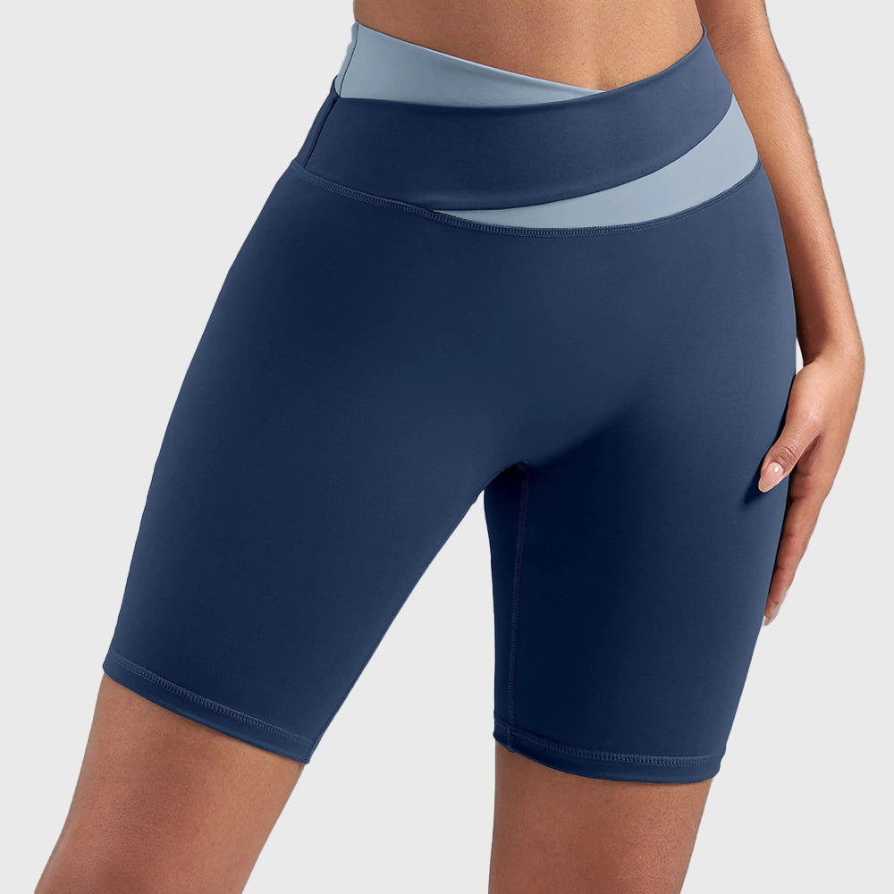 Women's crossover two-tone waist athletic workout shorts in navy blue with custom logo, custom yoga apparel manufacturer - front view.
