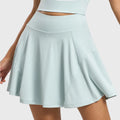 Back view of women's high waisted ribbed tennis skirt in mint green with custom logo, direct skirt manufacturer.