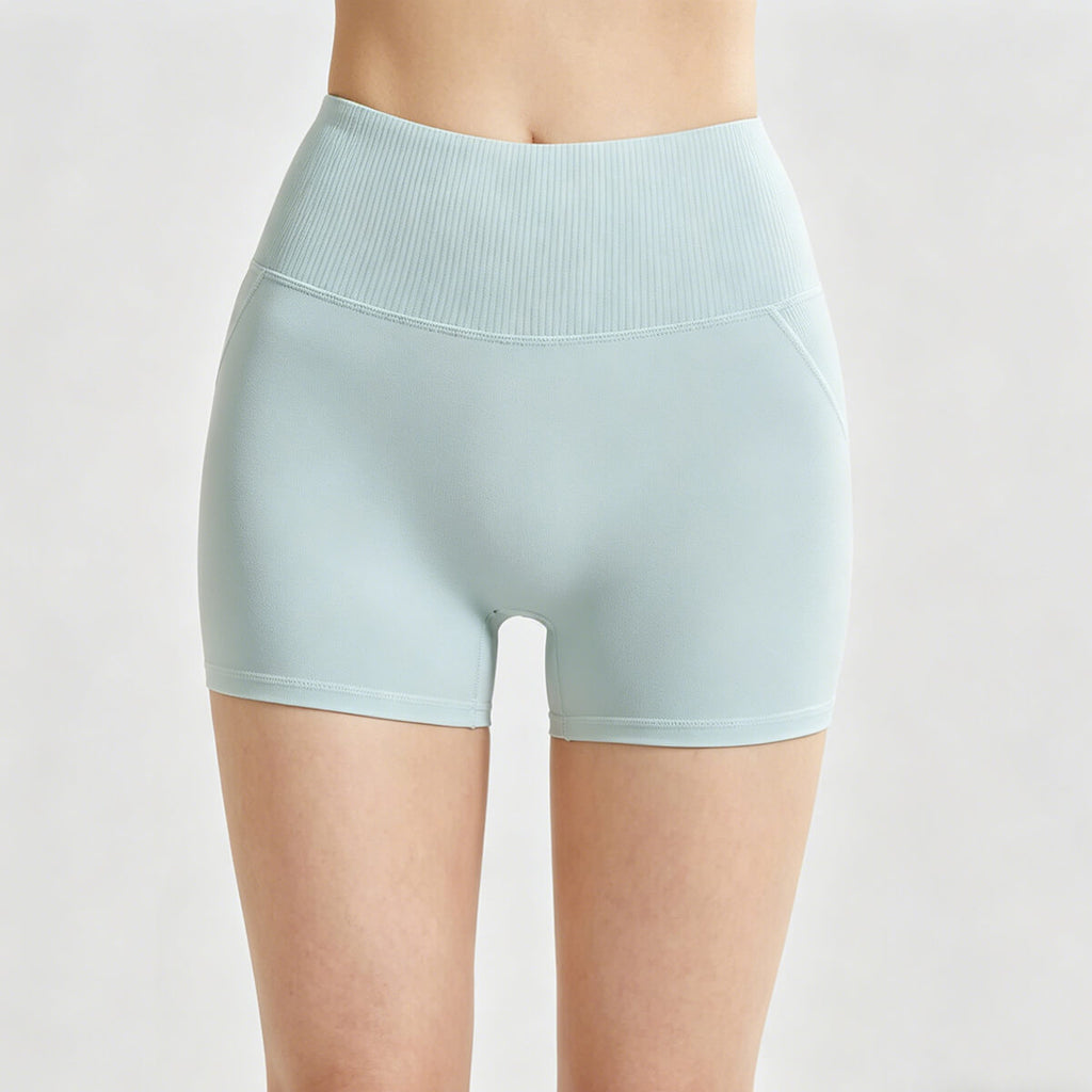 Front view of light cyan high-waisted yoga shorts with a wide ribbed waistband for tummy control and gym workouts
