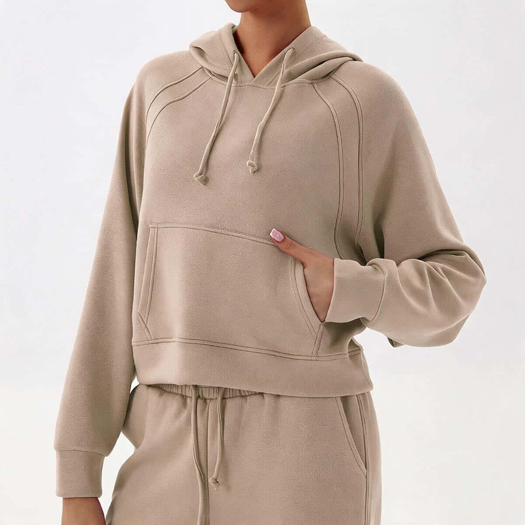 Womens khaki-colored cropped sweatsuit set featuring soft-touch fabric and stylish raglan sleeve stitching.