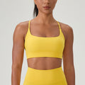 Front view of a lemon yellow athletic sports bra designed for comfort and mobility during gym workouts.