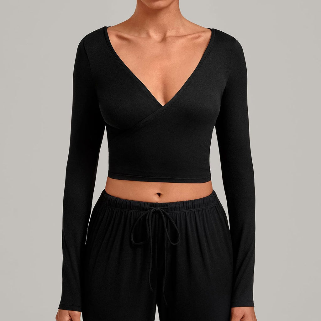 Front view of a black long-sleeve V-neck ballet wrap crop top.