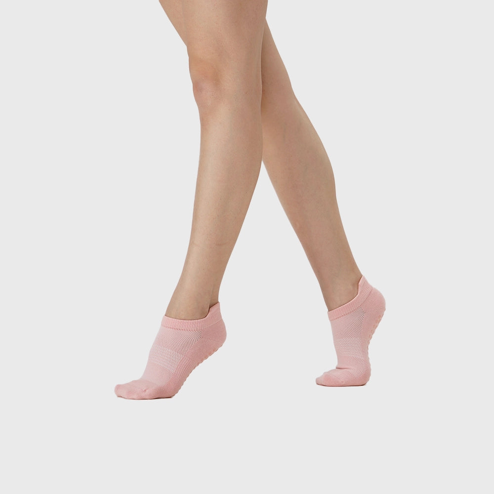 On-foot movement view of women's low cut pilates workout socks in pink with custom logo, OEM gym wear manufacturer.