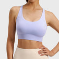 Front view of women's mesh insert racerback sports bra in lilac purple with custom logo, produced by activewear manufacturer.