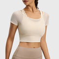 Women's sheer mesh short sleeve workout crop top with fixed pads in cream with custom logo, custom sportswear manufacturer - front view.
