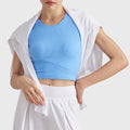 Styling view of women's sky blue ribbed fitted gym crop tank with custom logo service, direct from OEM garment manufacturer.
