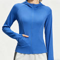 Front view of a women's royal blue hooded athletic jacket with full-zip and pockets.