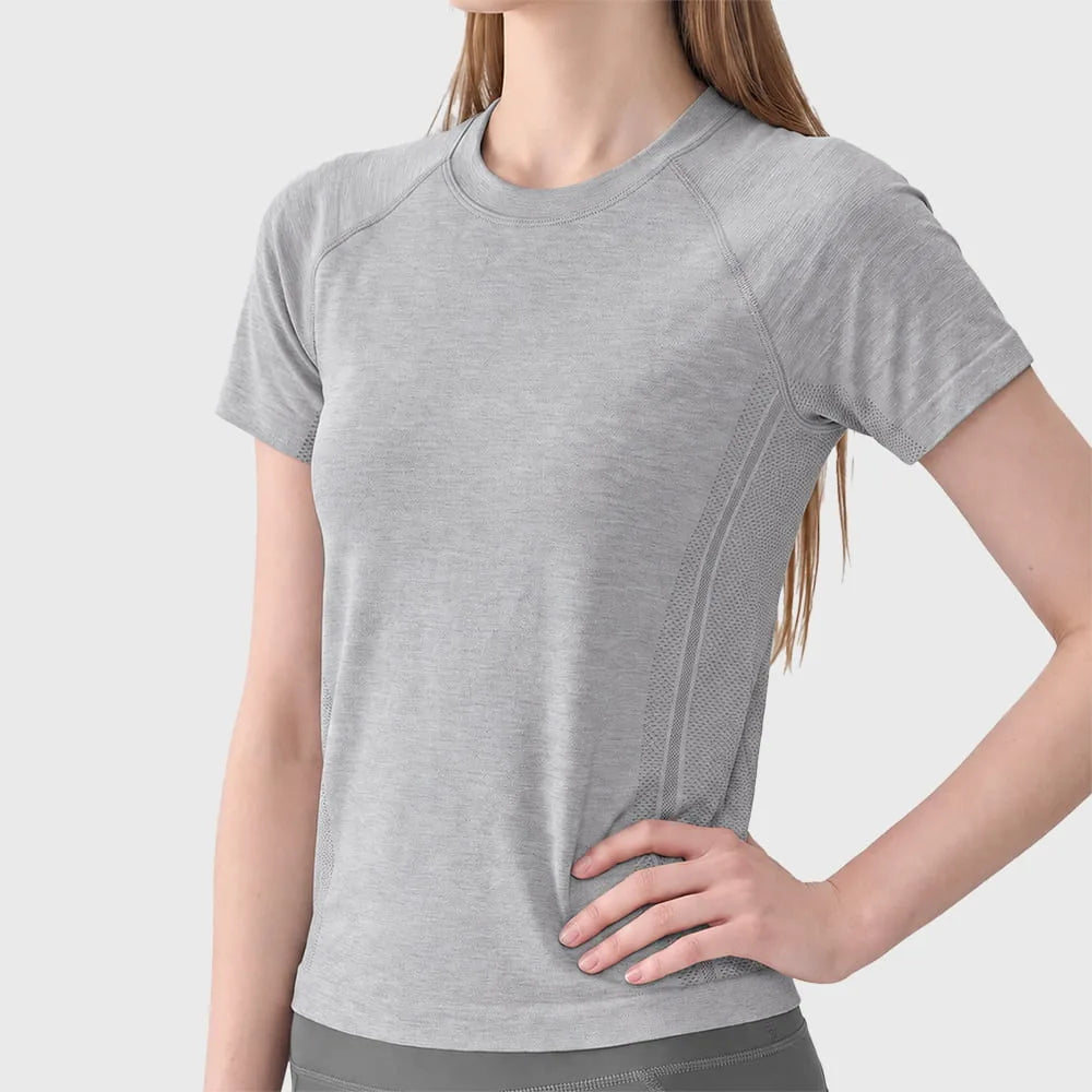 Side fit and waist detail of grey seamless mesh workout shirt with custom logo, supplied by activewear manufacturer.
