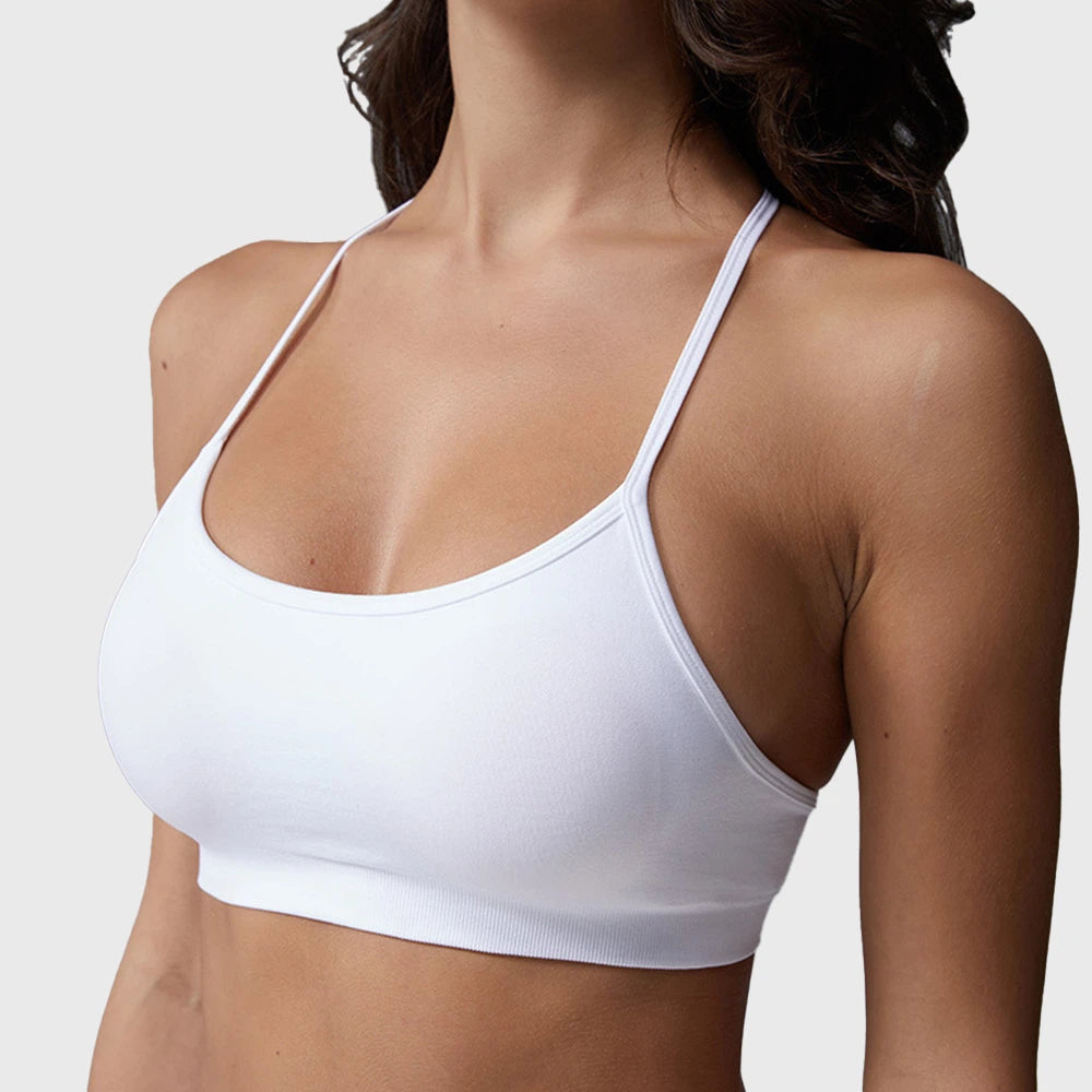 Side profile of women's seamless ribbed underband sports bra in white with custom logo, sportswear manufacturer.