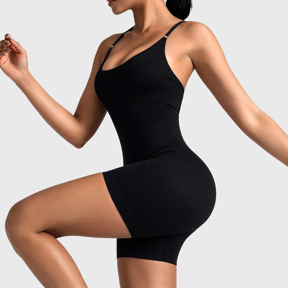 Side movement view of women's seamless athletic workout romper in black with custom logo, OEM sportswear manufacturer.