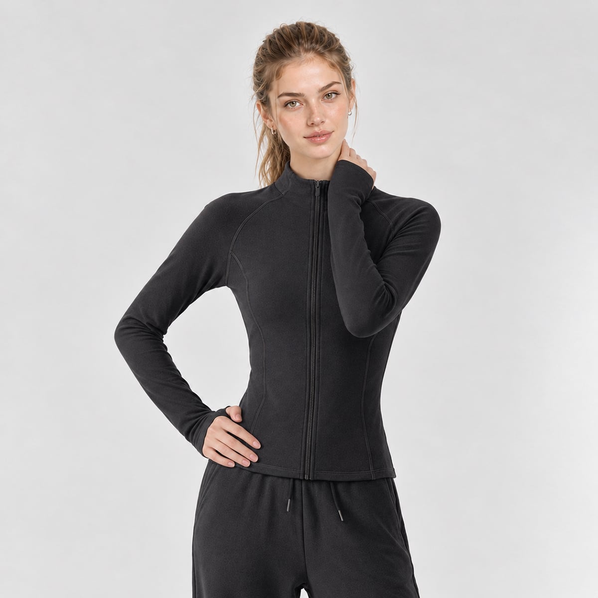 Front view of a charcoal grey stand-collar thermal athletic jacket.
