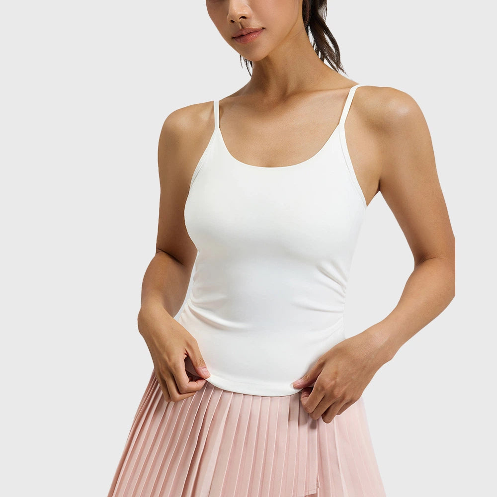 White slim fit yoga cami top with curved hemline and custom logo options from private label activewear manufacturer.
