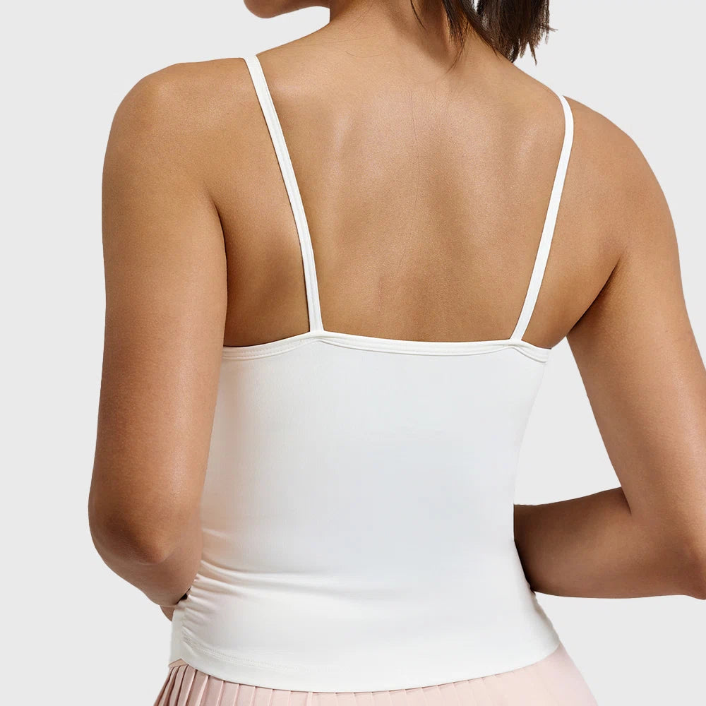 Back view and low straight back cut of white spaghetti strap ruched yoga tank with custom logo, produced by activewear manufacturer.
