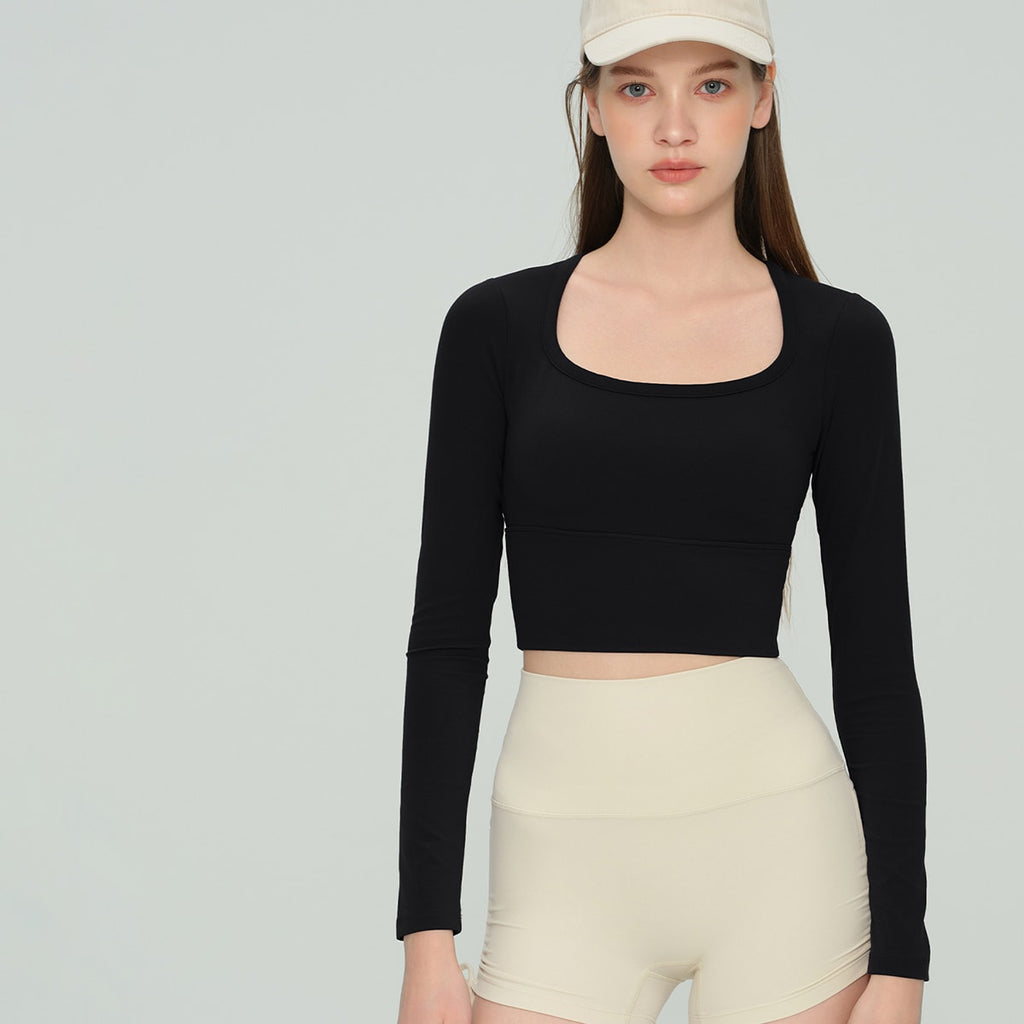 Classic black fitted square neck long-sleeve athletic crop top front view.