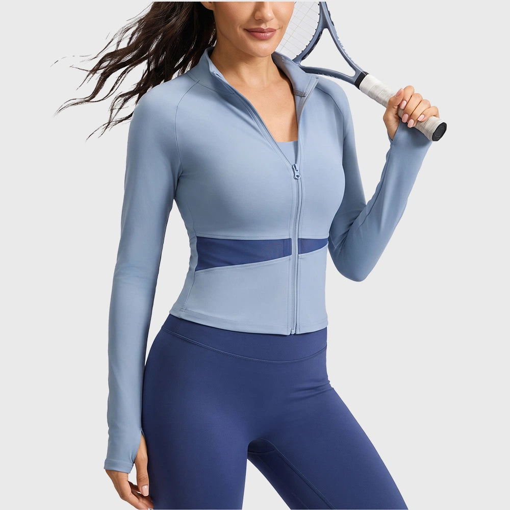 Athletic fit of women's colorblock zip up jacket with thumbholes in steel blue with custom logo, activewear manufacturer.