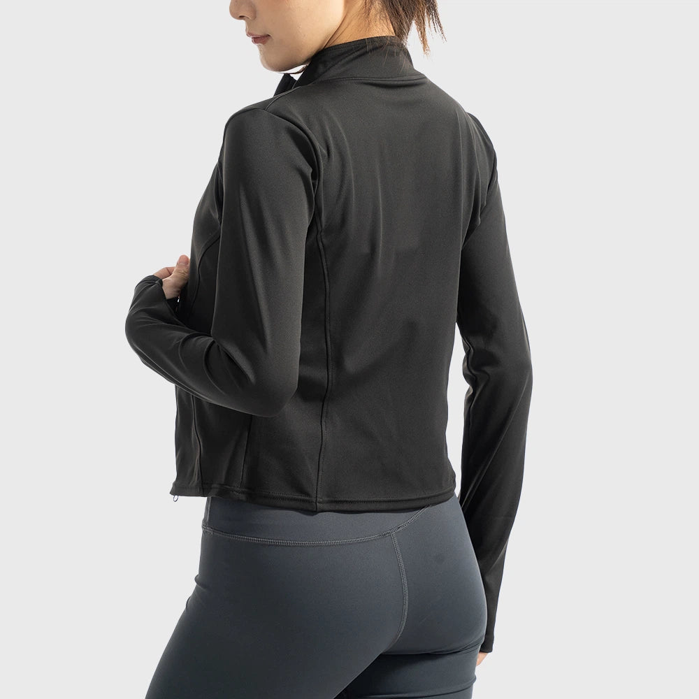 Back view of women's full zip athletic yoga jacket with princess seams in black with custom logo, direct clothing manufacturer.