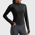 Women's stand collar contour full zip yoga jacket in black with custom logo, OEM activewear manufacturer - front view.
