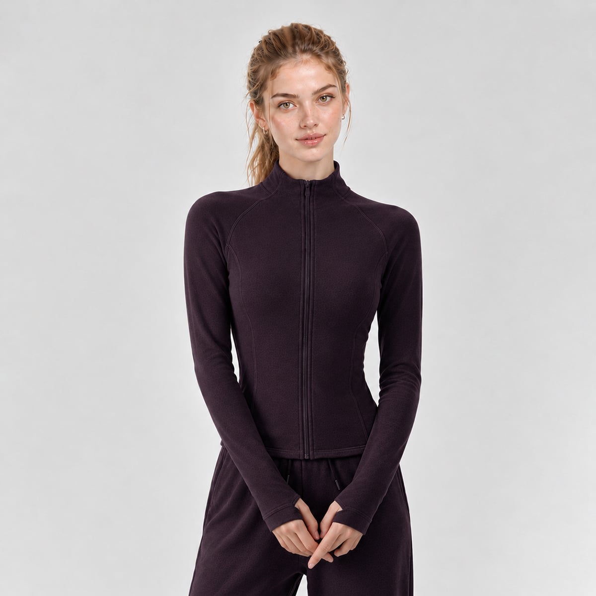 Front view of a deep plum full-zip running jacket with thumbhole sleeves.