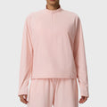 Women's waffle knit stand collar half zip sweatshirt in light pink with custom logo, direct clothing manufacturer.
