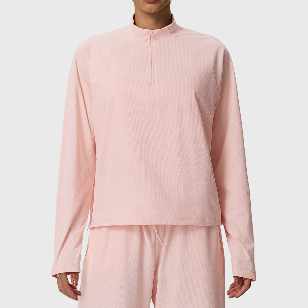 Women's waffle knit stand collar half zip sweatshirt in light pink with custom logo, direct clothing manufacturer.
