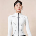 Front view of a women's white full-zip workout jacket with grey contrast piping, featuring a slim-fit athletic design for yoga and gym.